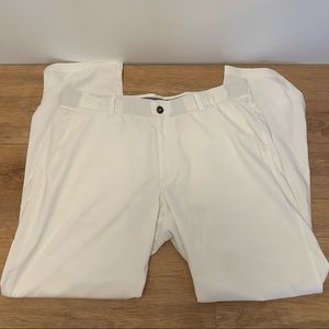 Men’s white Under Armour golf pants.